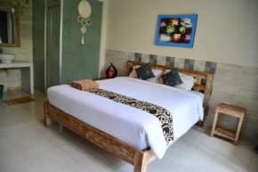 Отель Asung Guesthouse  North Kuta